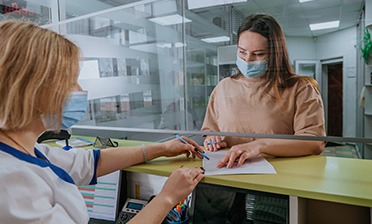 Patient in Chicago talking to front desk about financing