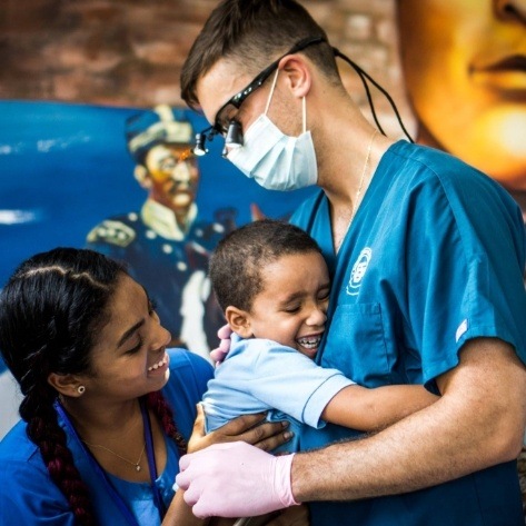 Dental team members volunteering at community event