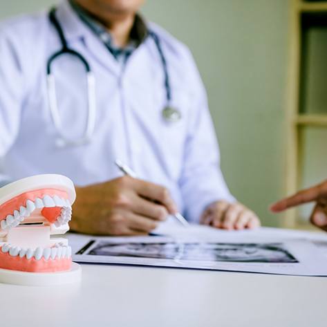 dentist discussing the cost of dental implants in Chicago