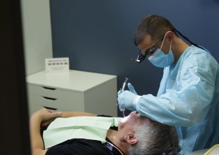 Dentist in Chicago treating a dental patient
