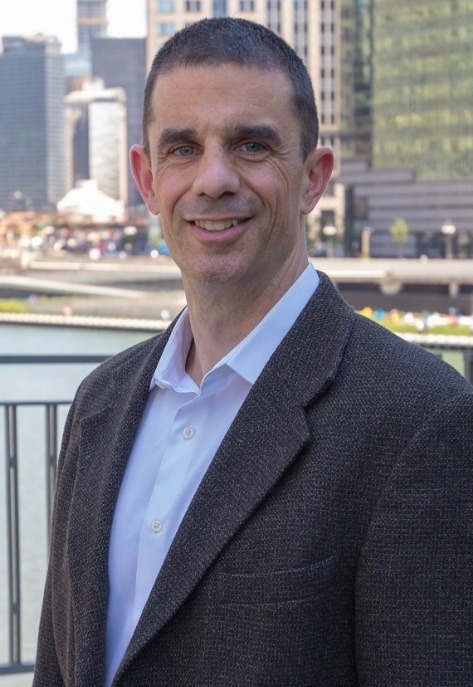 Doctor Hammes with Chicago skyline in the background
