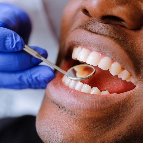 Patient receiving oral cancer screening