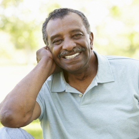 Man sharing smile after full mouth reconstruction