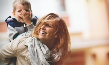 Smiling mother and child after children's dentistry visit