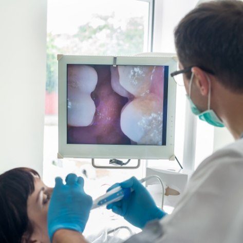 Dentist using intraoral cameras to capture smile photos