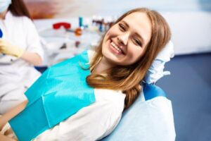 Woman smiling after dental crown placement
